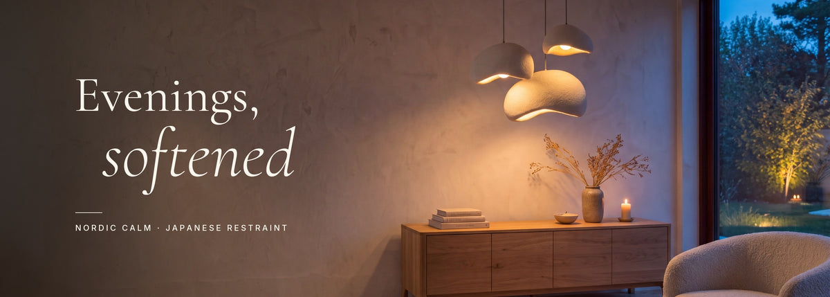 Evenings, softened — three Shiro pendants glowing above an oak sideboard at dusk