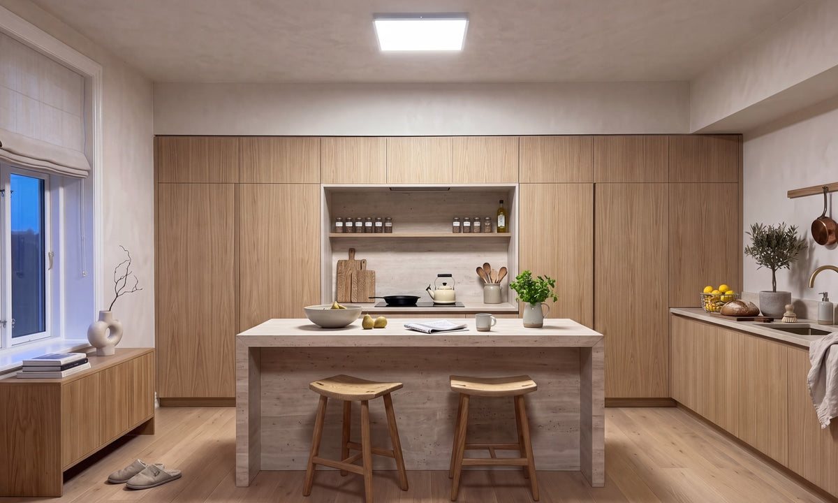Kitchen before: one harsh cold LED ceiling panel over oak and travertine